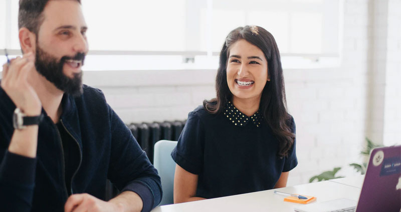 A man and a woman enjoying a class