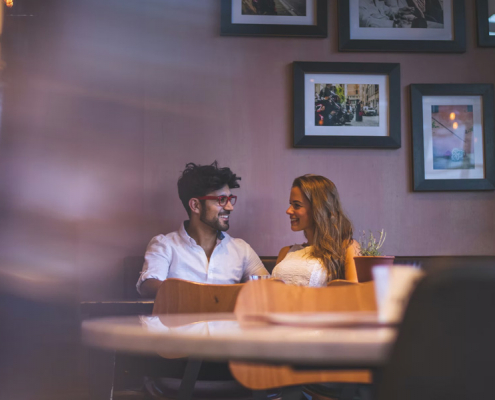 Happy couple in a date at a restaurant.