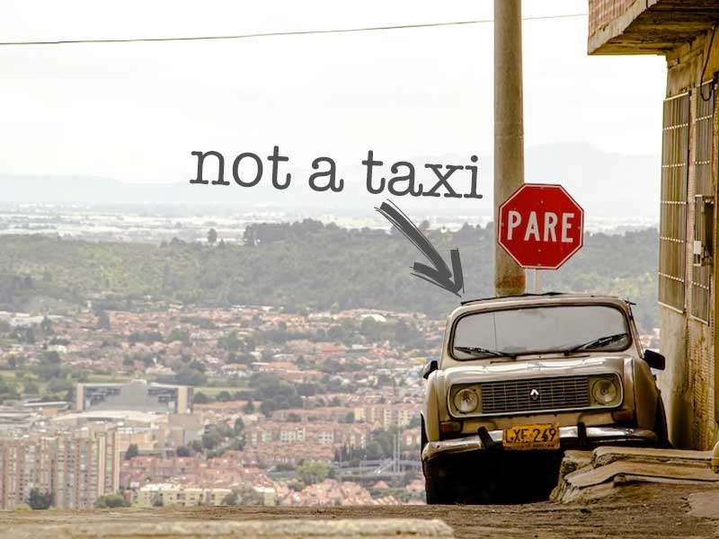 A Car in Bogotá, Colombia, the photo has the text "not a taxi" The Best Way to Navigate Bogotá's Public Transport while learning Spanish.