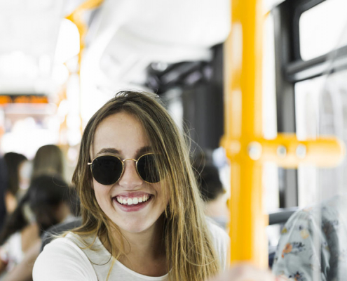 Student riding a bus in Bogota. The secret to learning Spanish faster? Ride Bogota's buses and TransMilenio!