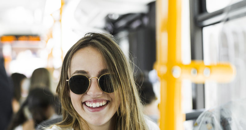 Student riding a bus in Bogota. The secret to learning Spanish faster? Ride Bogota's buses and TransMilenio!