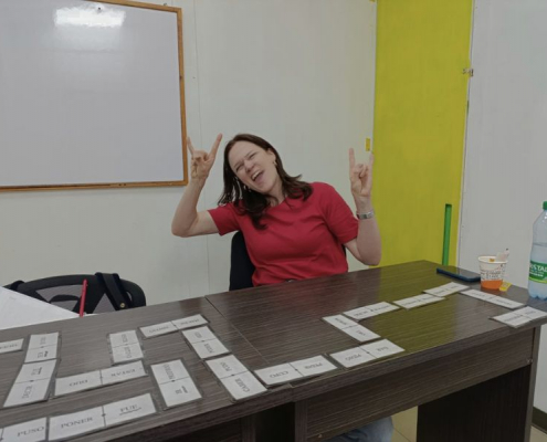 Happy international student studying Spanish in a classroom in Bogotá